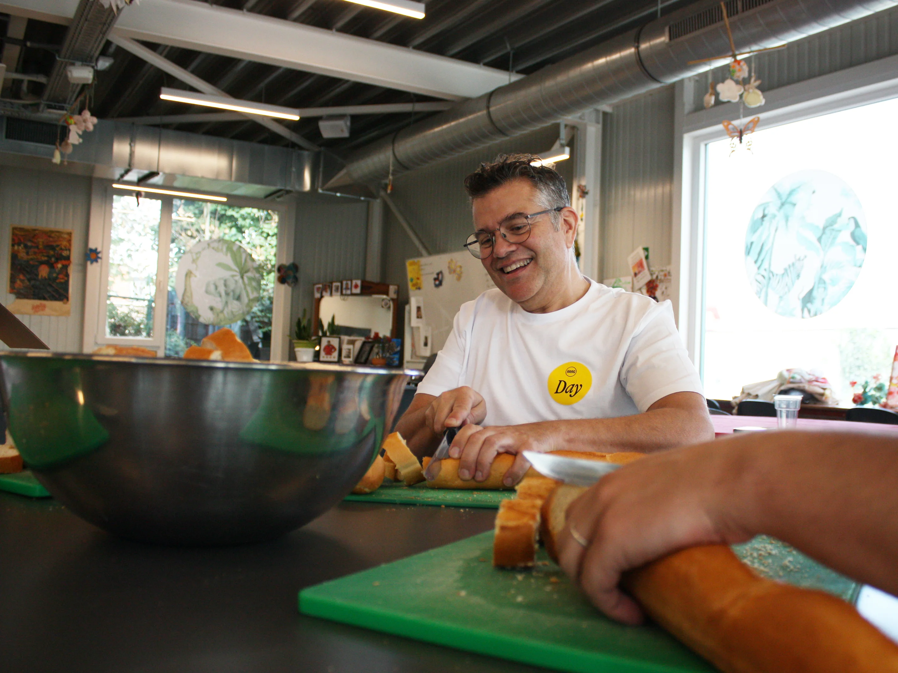 man cutting bread